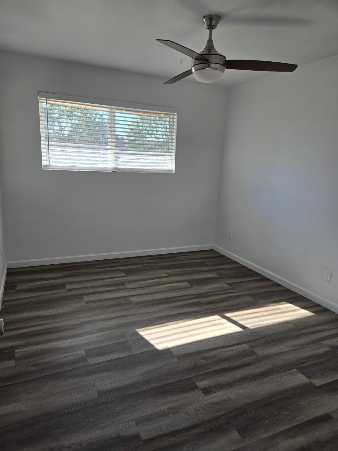 620 East Broadway Lane Tempe, AZ 85282 - Photo 7 of 15 a view of a room with wooden floor and a window