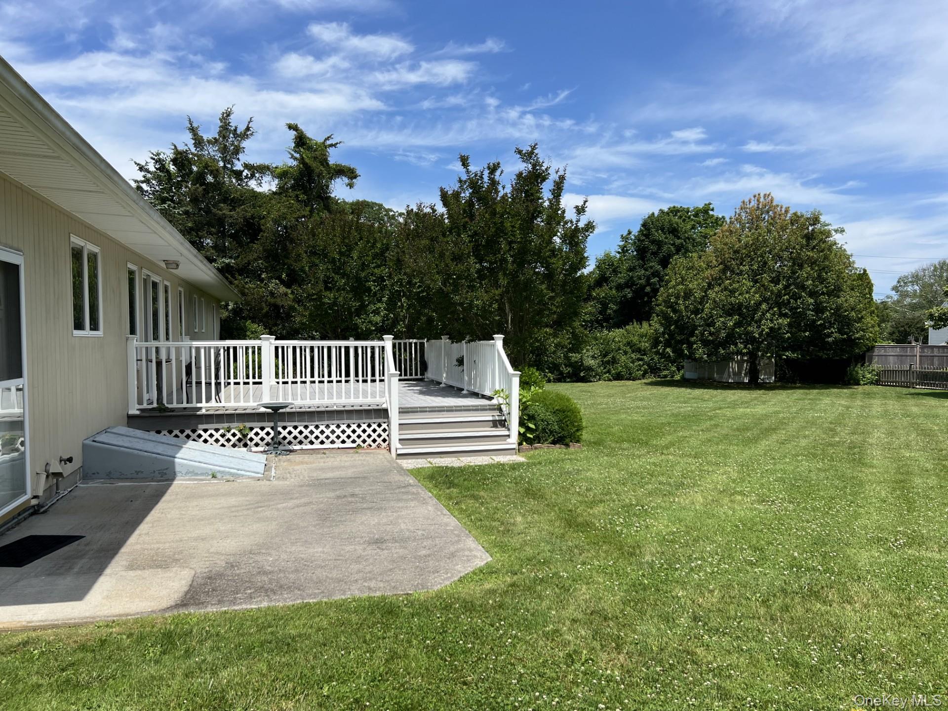215 Leon Road Southold, NY 11971 - Photo 2 of 17 The deck and patio