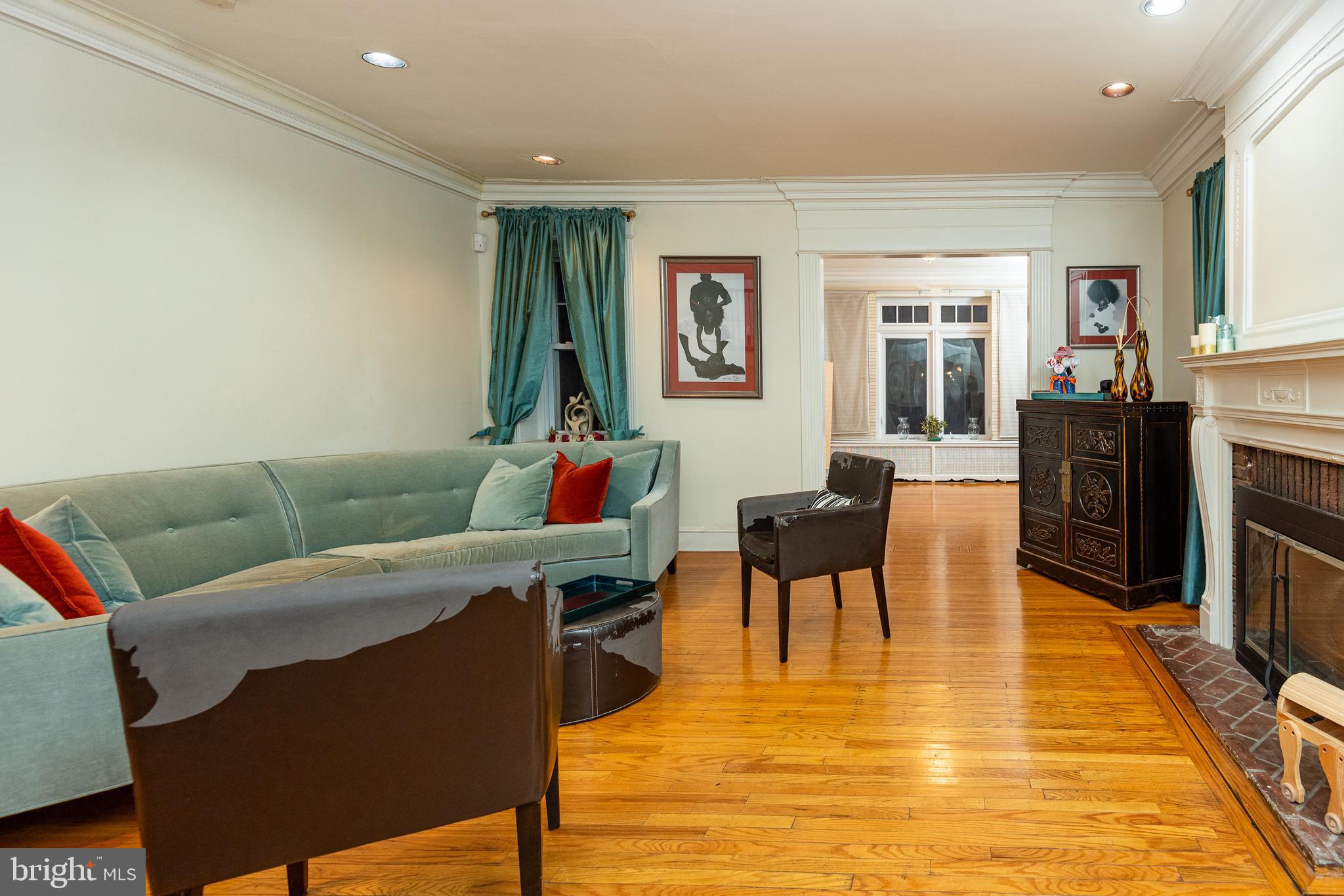 426 Glen Echo Road Philadelphia, PA 19119 - Photo 11 of 77 a living room with furniture and a fireplace