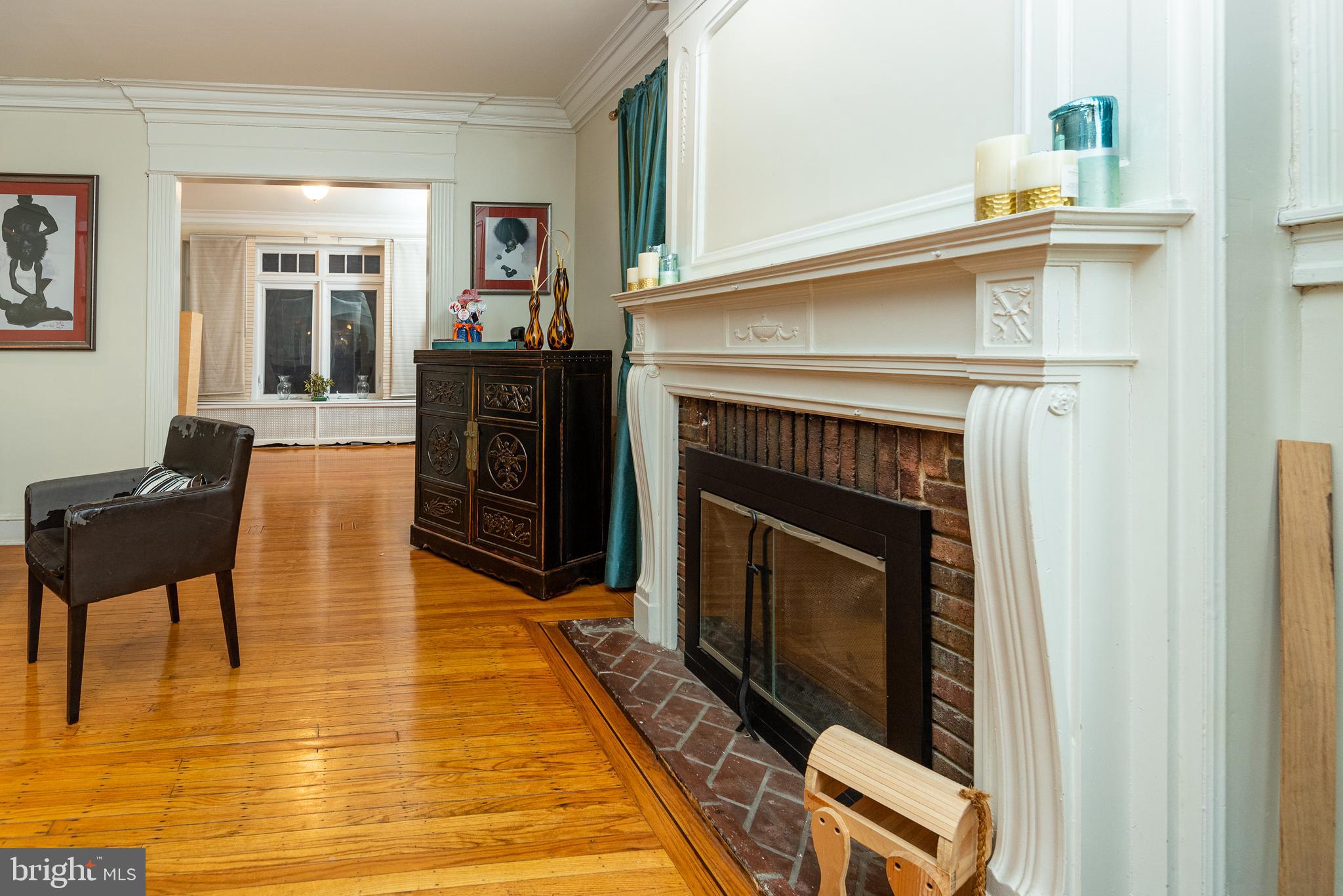426 Glen Echo Road Philadelphia, PA 19119 - Photo 13 of 77 living room into sunroom, original fireplace