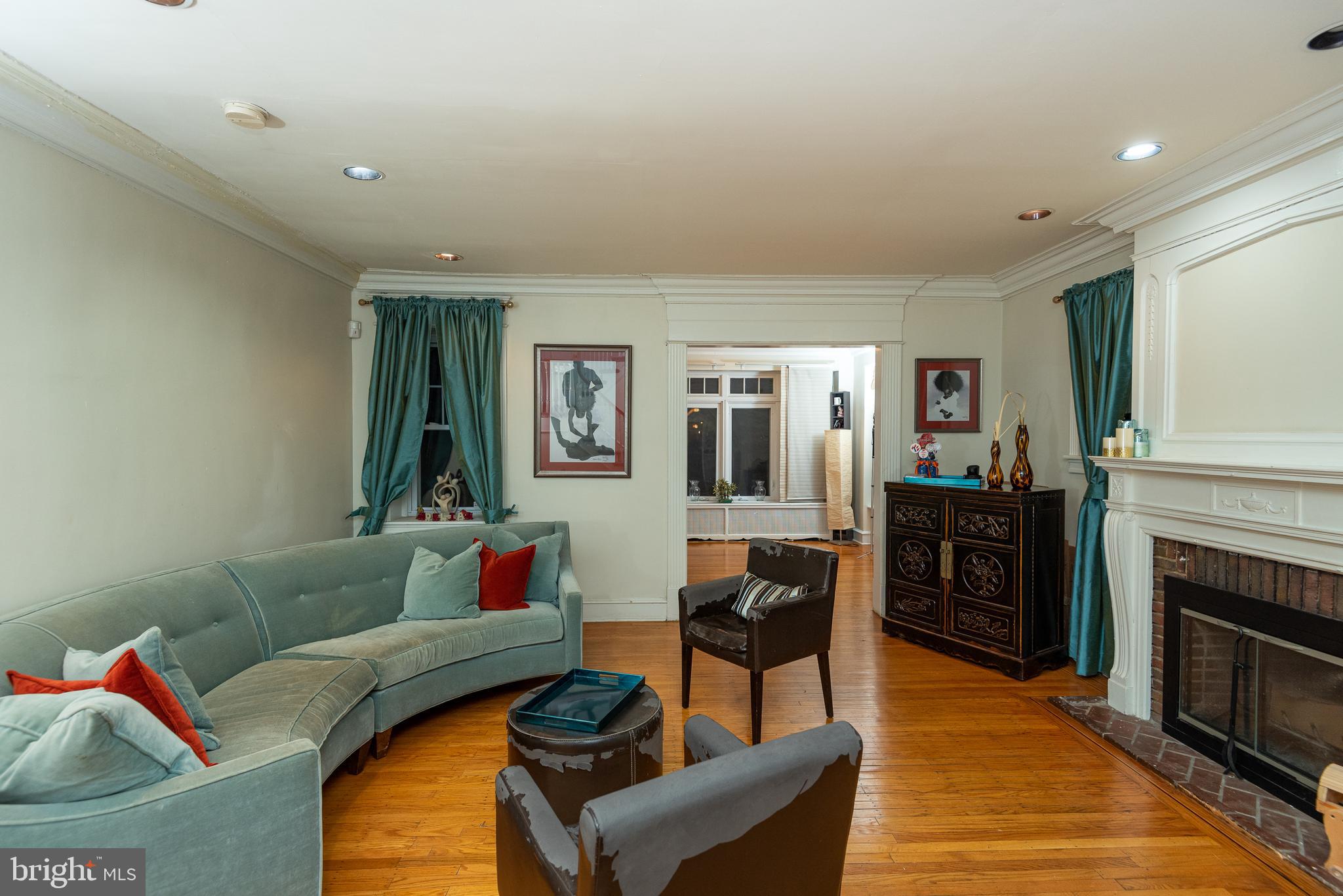 426 Glen Echo Road Philadelphia, PA 19119 - Photo 16 of 77 a living room with furniture and a fireplace