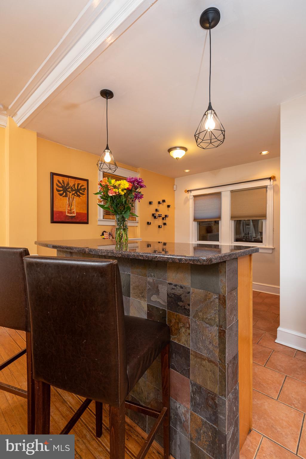 426 Glen Echo Road Philadelphia, PA 19119 - Photo 24 of 77 a kitchen with stainless steel appliances kitchen island granite countertop a table and chairs in it