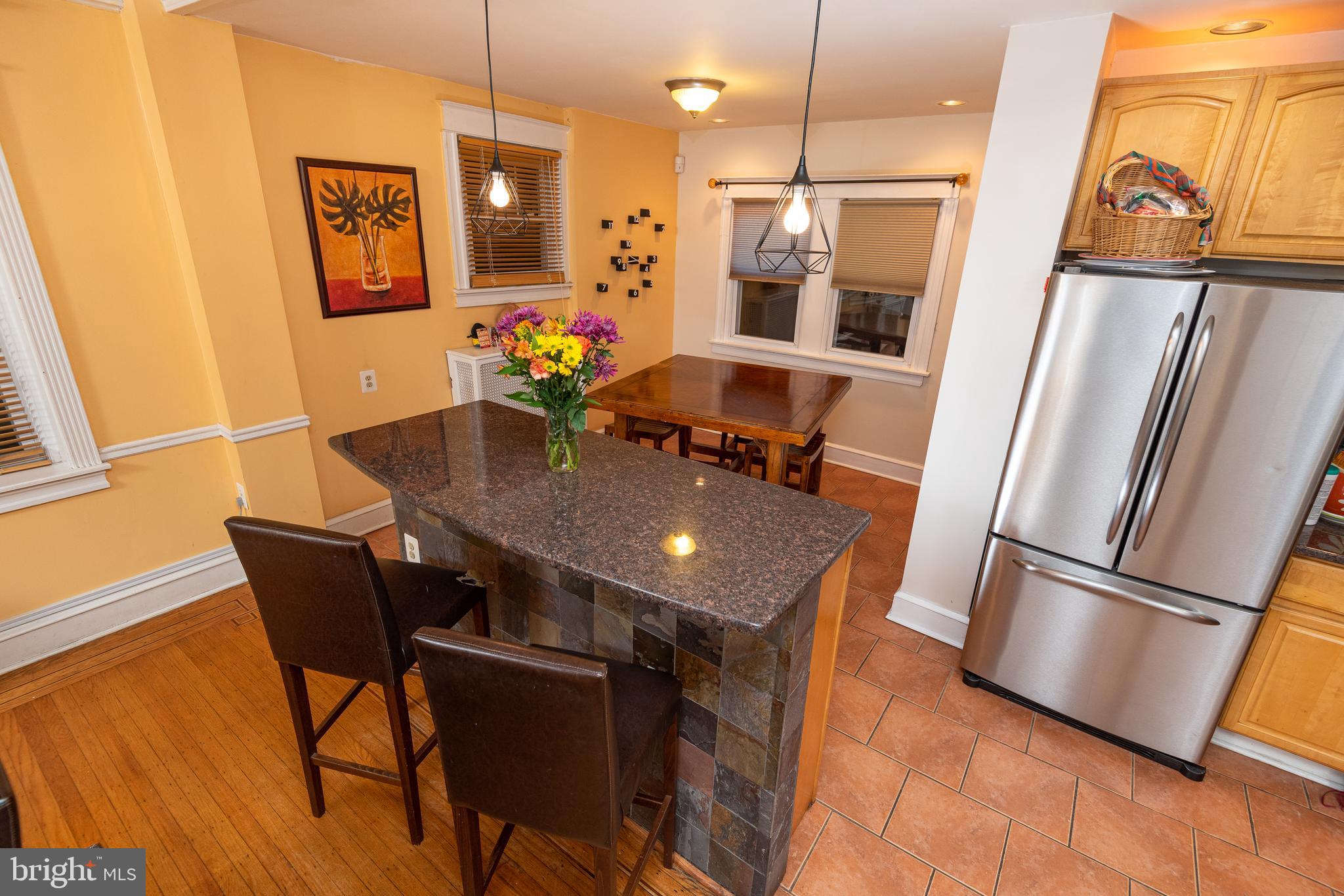 426 Glen Echo Road Philadelphia, PA 19119 - Photo 25 of 77 a view of a dining room with furniture wooden floor and a chandelier