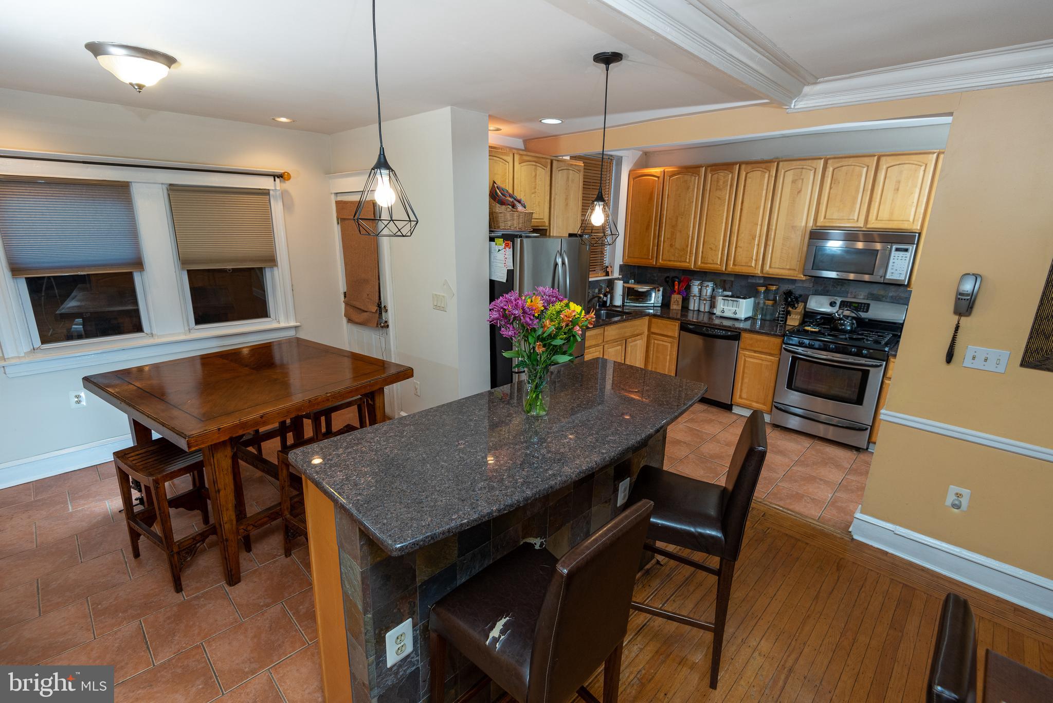 426 Glen Echo Road Philadelphia, PA 19119 - Photo 35 of 77 a view of a dining room with furniture and a chandelier
