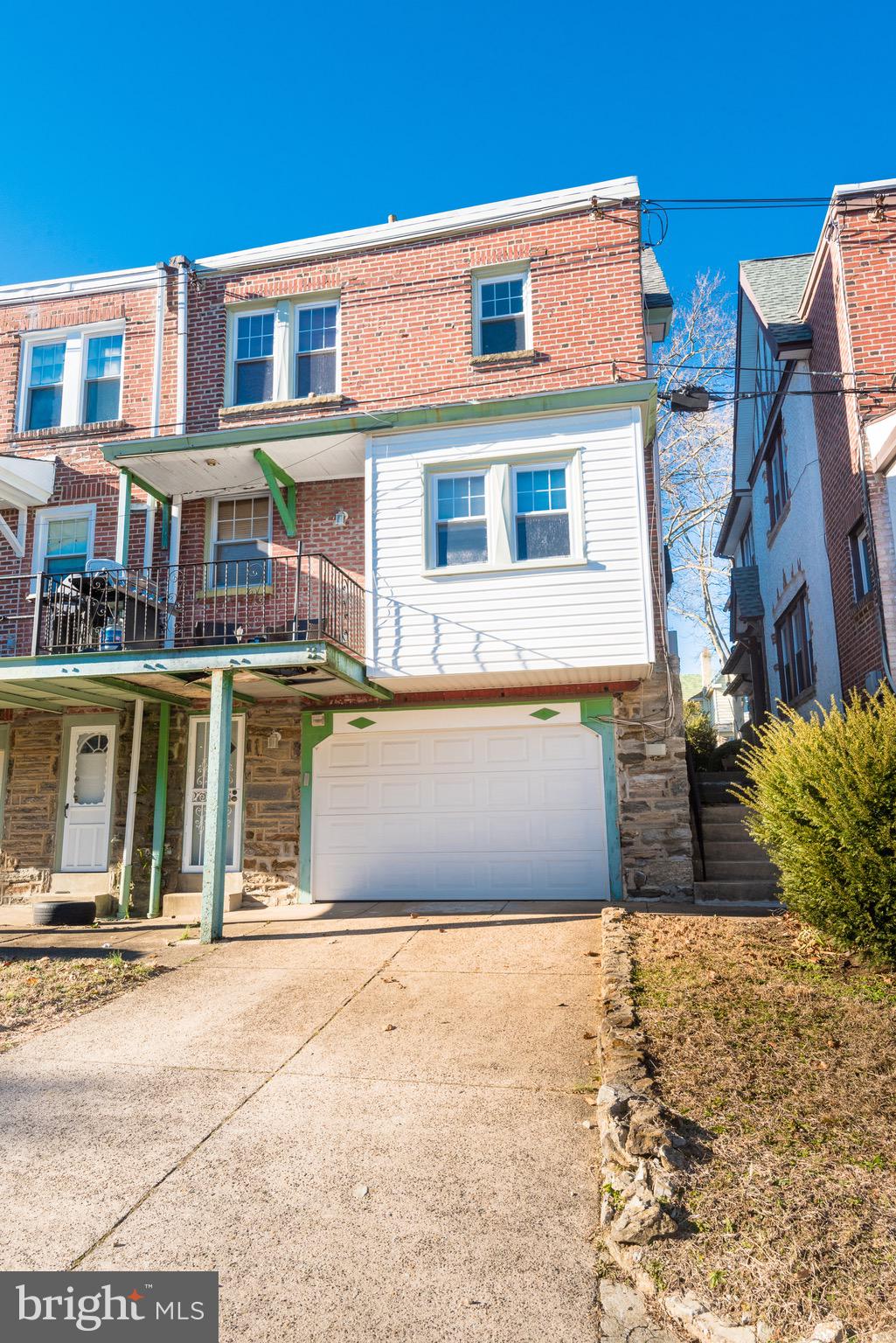 426 Glen Echo Road Philadelphia, PA 19119 - Photo 6 of 77 a front view of a building with a garden