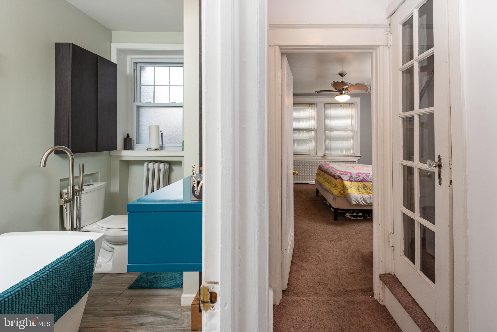 426 Glen Echo Road Philadelphia, PA 19119 - Photo 51 of 77 a en suite bathroom with a sink a mirror and a bathtub