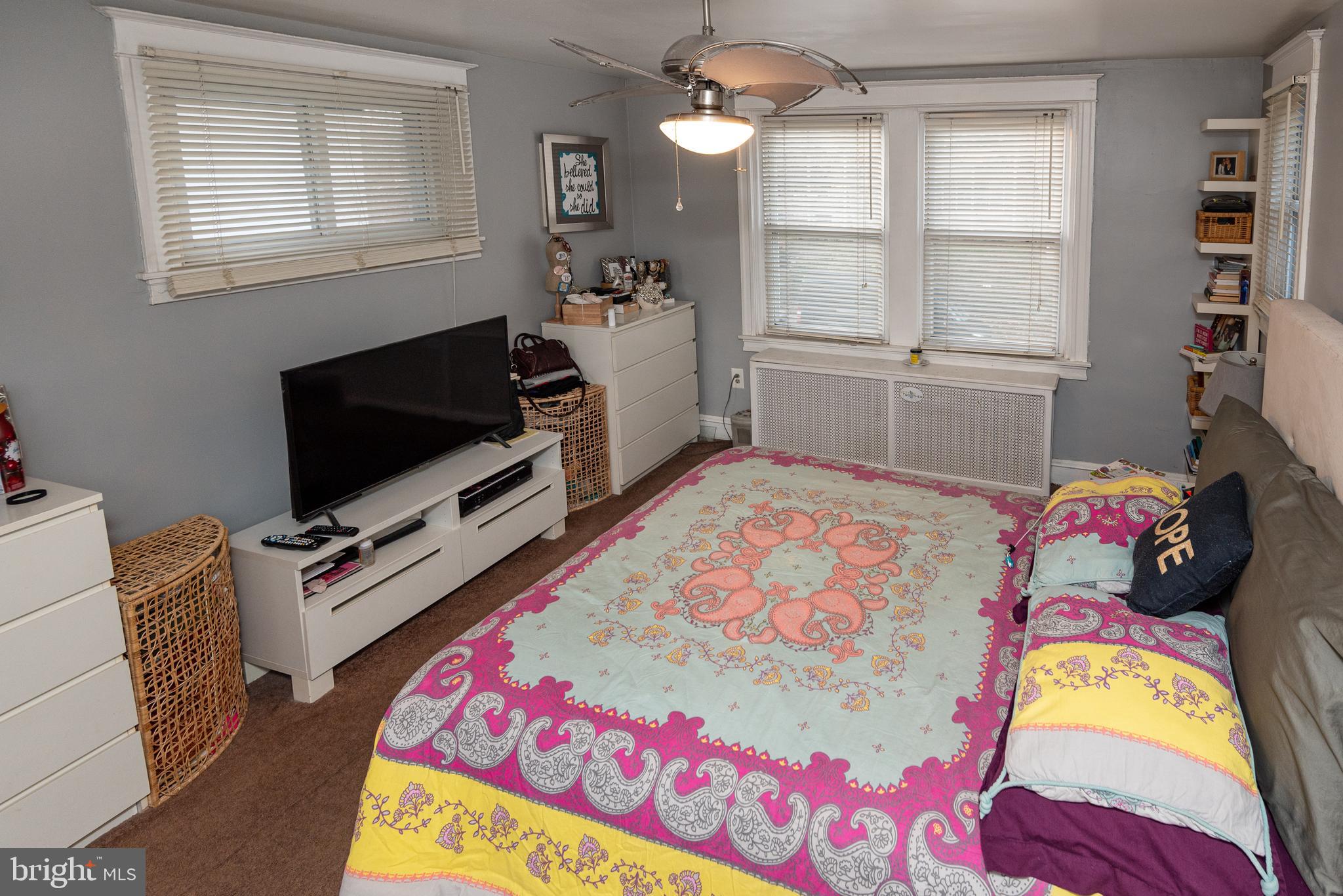 426 Glen Echo Road Philadelphia, PA 19119 - Photo 53 of 77 a bedroom with a bed and flat screen tv