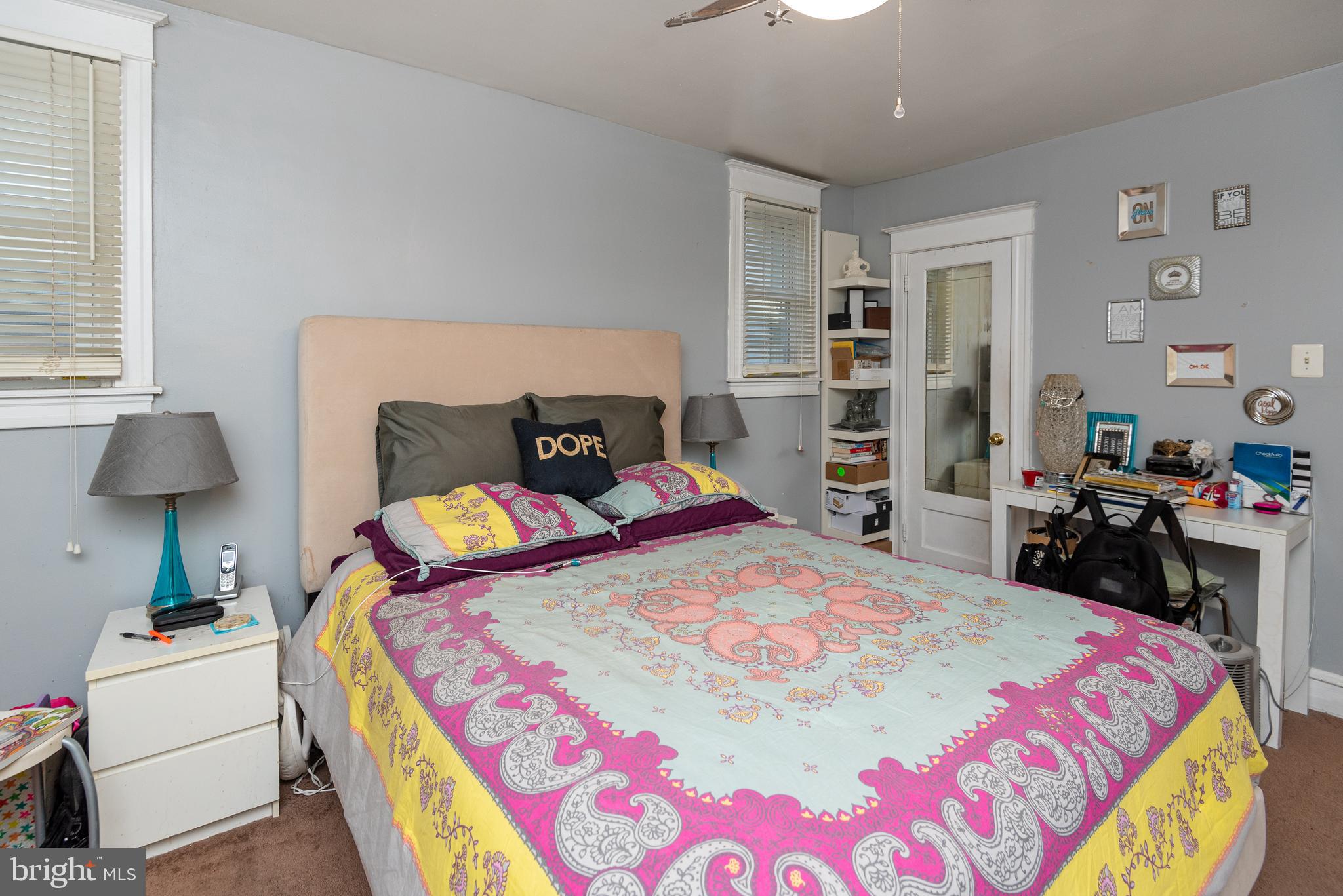 426 Glen Echo Road Philadelphia, PA 19119 - Photo 55 of 77 a bedroom with a bed and a lamp