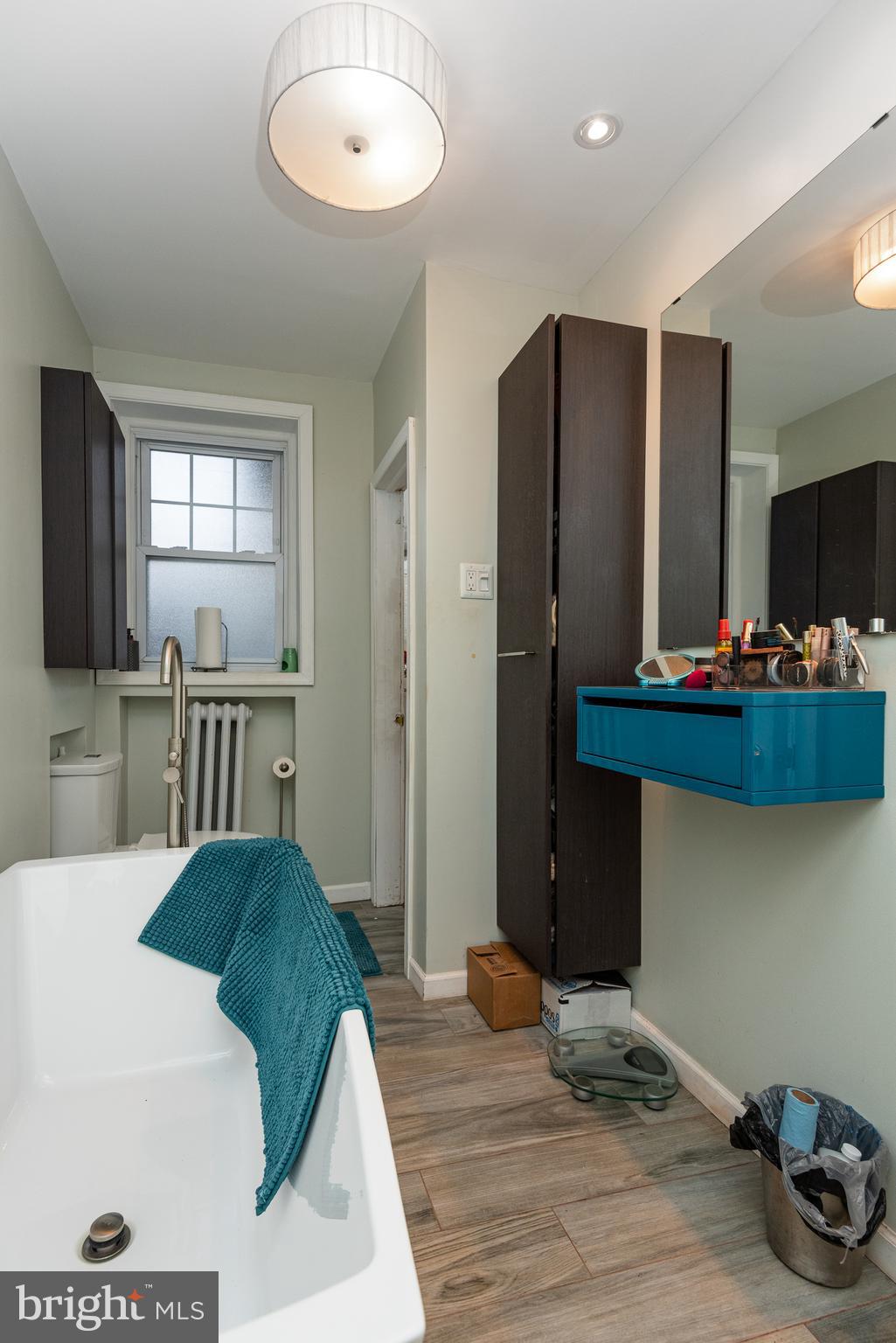 426 Glen Echo Road Philadelphia, PA 19119 - Photo 63 of 77 a living room with kitchen furniture and flat screen tv