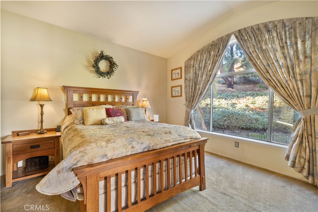 27729 Villa Canyon Road Castaic, CA 91384 - Photo 42 of 72 a bed sitting in a bedroom next to a window