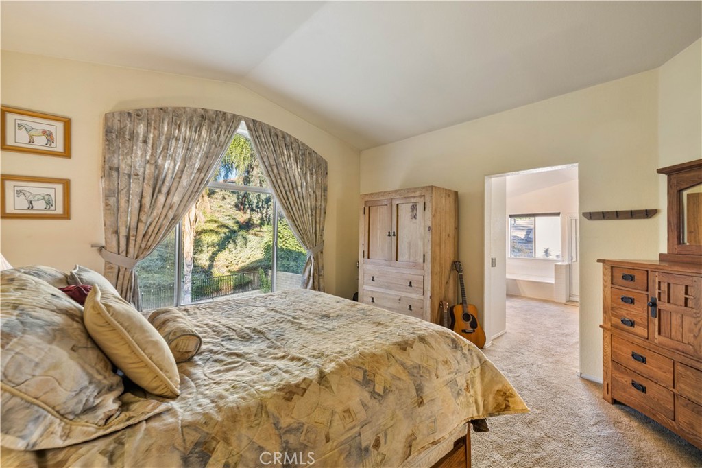 27729 Villa Canyon Road Castaic, CA 91384 - Photo 43 of 72 a bedroom with a bed and a dresser