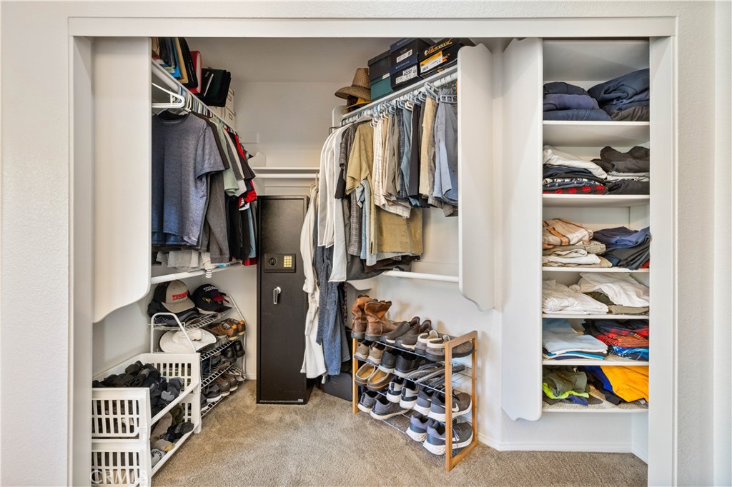 27729 Villa Canyon Road Castaic, CA 91384 - Photo 47 of 72 a view of walk in closet with clothes and shoes