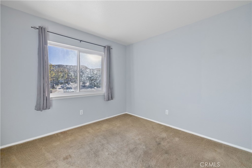 27729 Villa Canyon Road Castaic, CA 91384 - Photo 52 of 72 an empty room with a window