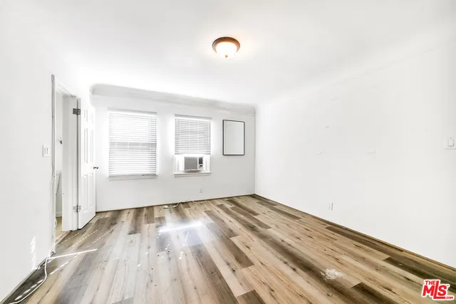 a bathroom with a sink a mirror and shower