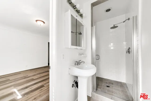a bathroom with a sink a toilet and bathtub