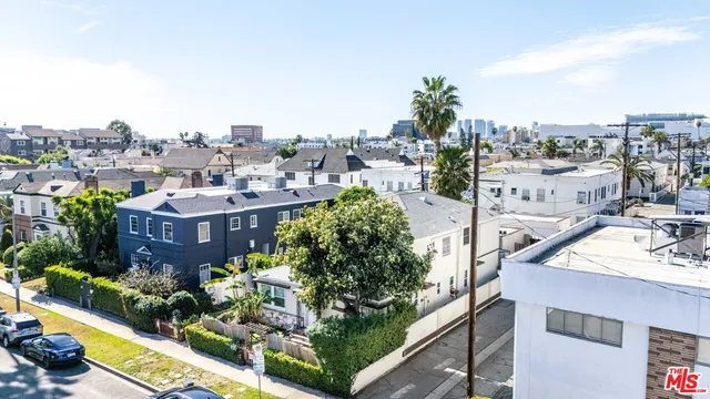 a aerial view of a house with a garden and plants