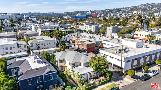 an aerial view of a house with a garden