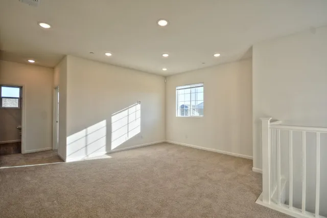 a view of an empty room and a window