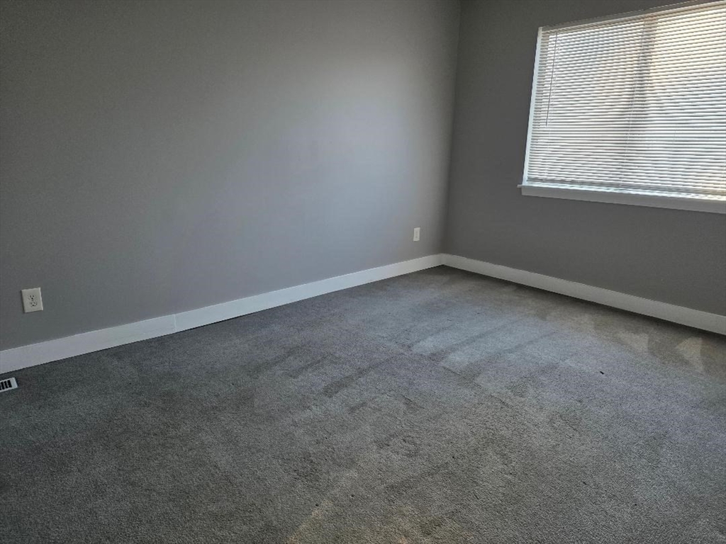 24 Harvard Road, Unit C Ayer, MA 01432 - Photo 13 of 20 an empty room with a window
