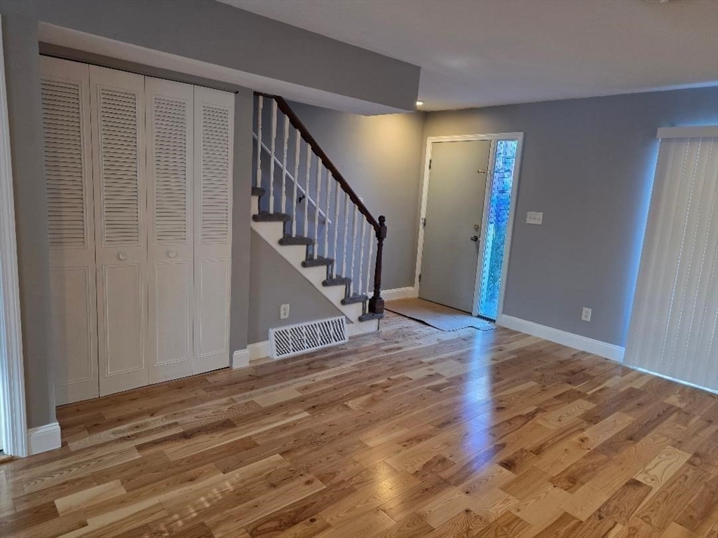 24 Harvard Road, Unit C Ayer, MA 01432 - Photo 4 of 20 a view of entryway with wooden floor