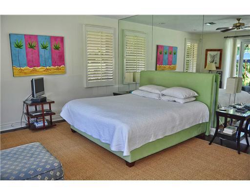 3205 Northwest 59th Street Boca Raton, FL 33496 - Photo 11 of 23 a bedroom with a bed dresser and a window