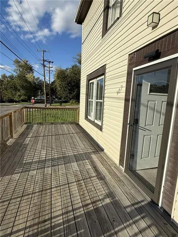a view of a balcony with wooden floor