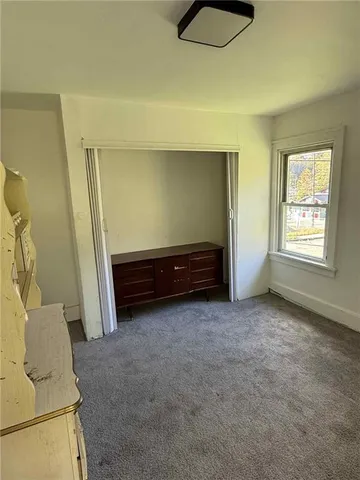 wooden floor and window in a room
