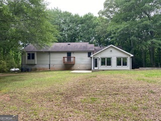 1117 Boss Hardy Road Auburn, GA 30011 - Photo 5 of 19 a front view of a house with a yard