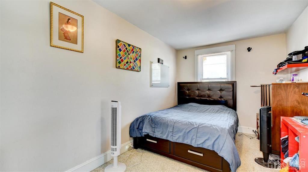 919 Hermann Road North Brunswick, NJ 08902 - Photo 11 of 13 a bedroom with a bed and a window