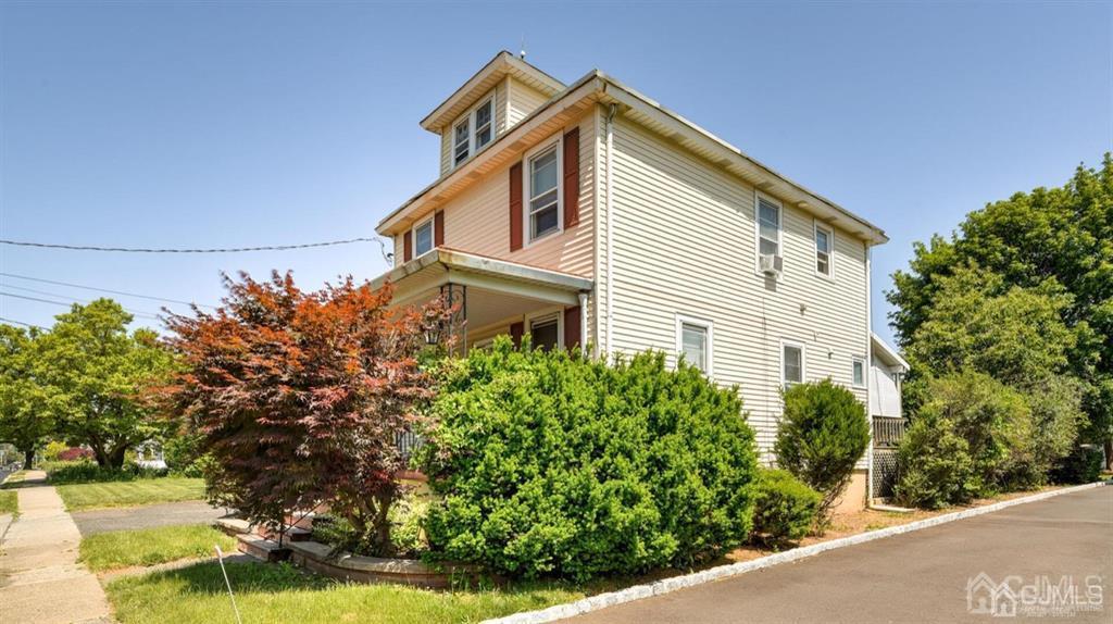 919 Hermann Road North Brunswick, NJ 08902 - Photo 2 of 13 a front view of a house with a yard