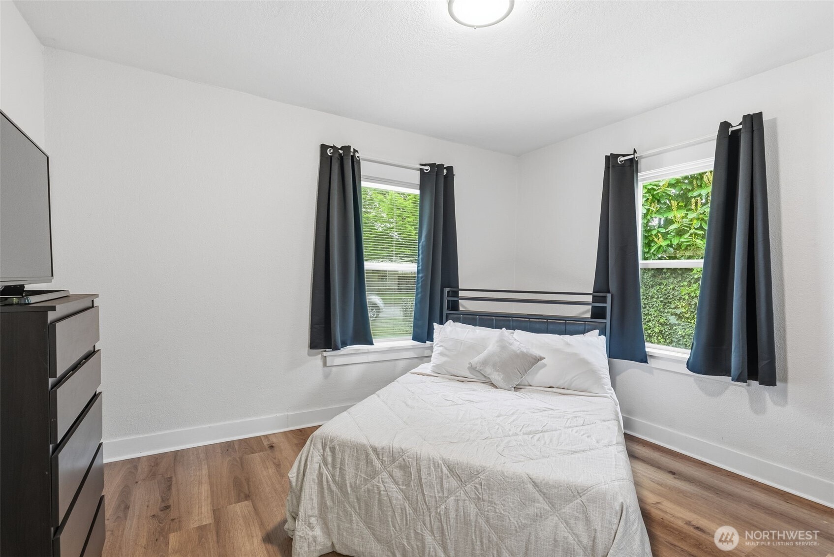 2828 Fir Street Longview, WA 98632 - Photo 12 of 18 a bedroom with a bed and a large window