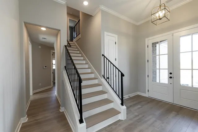 a view of a livingroom with stairs and stairs