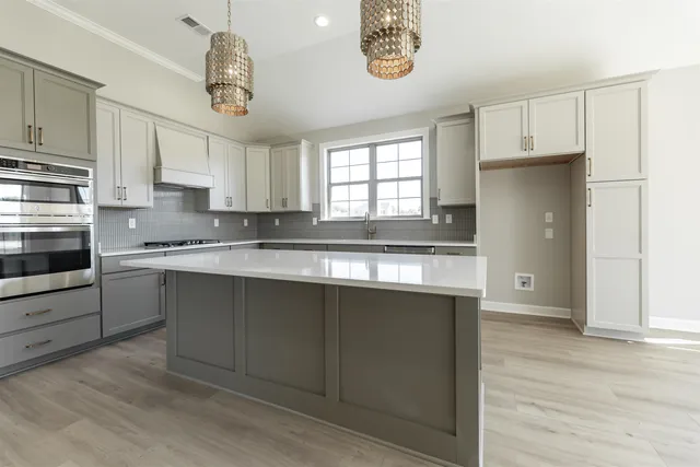 a kitchen with a refrigerator and window