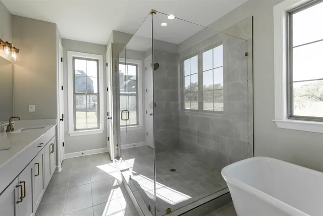 a bathroom with a tub and window
