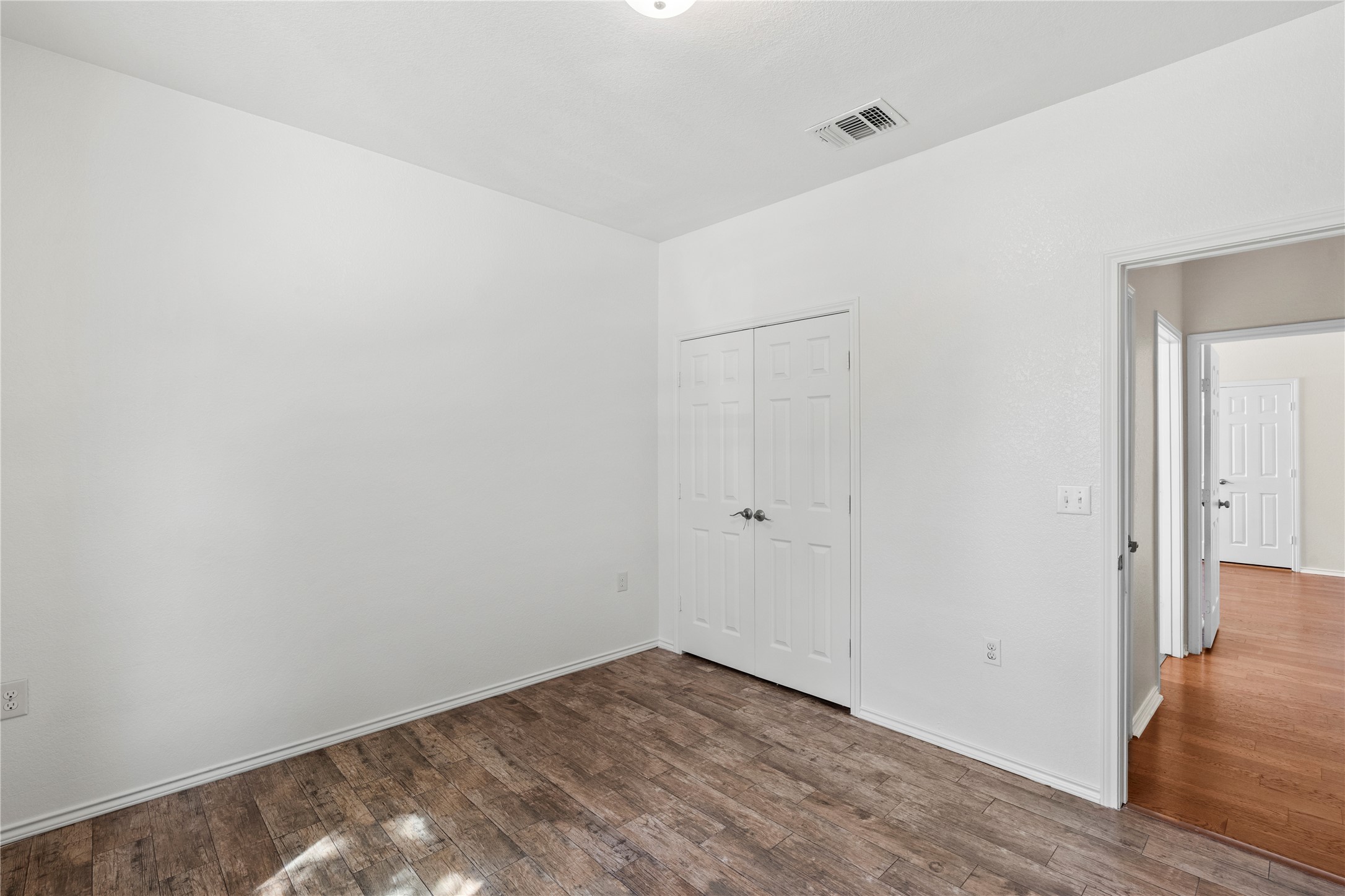 8613 Capitol View Drive Austin, TX 78747 - Photo 5 of 33 Well-maintained flooring complements the clean, neutral palette of this inviting interior space.