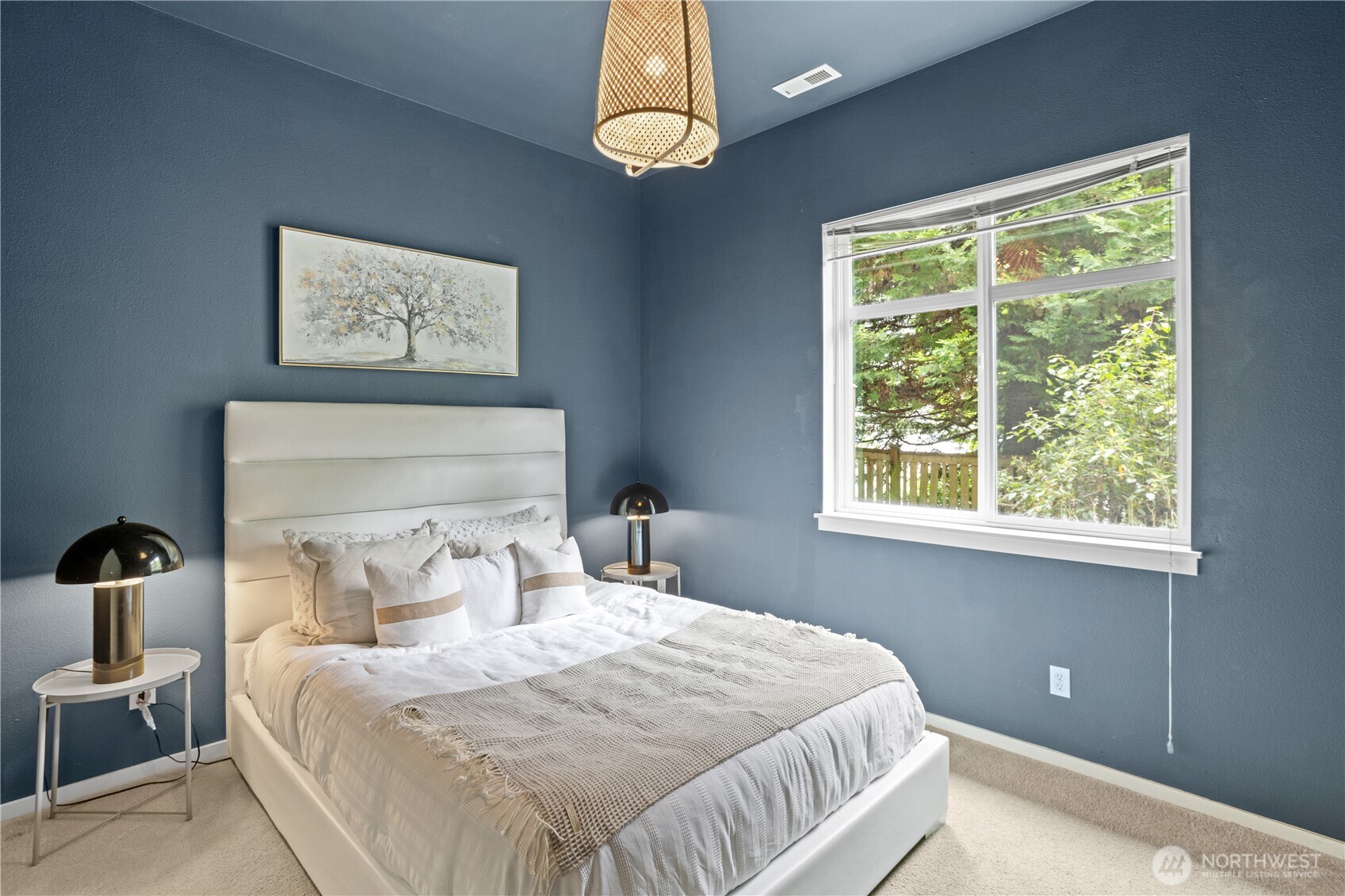 176 Cougar Ridge Road Northwest, Unit 2302 Issaquah, WA 98027 - Photo 26 of 30 a bedroom with a bed and a window