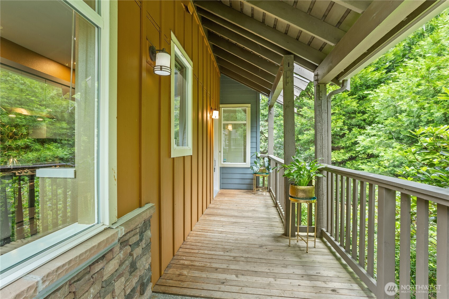176 Cougar Ridge Road Northwest, Unit 2302 Issaquah, WA 98027 - Photo 3 of 30 a view of a balcony with wooden floor