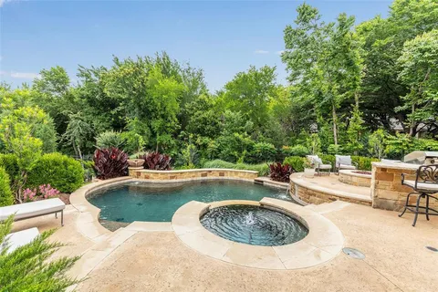 a view of a swimming pool with a patio