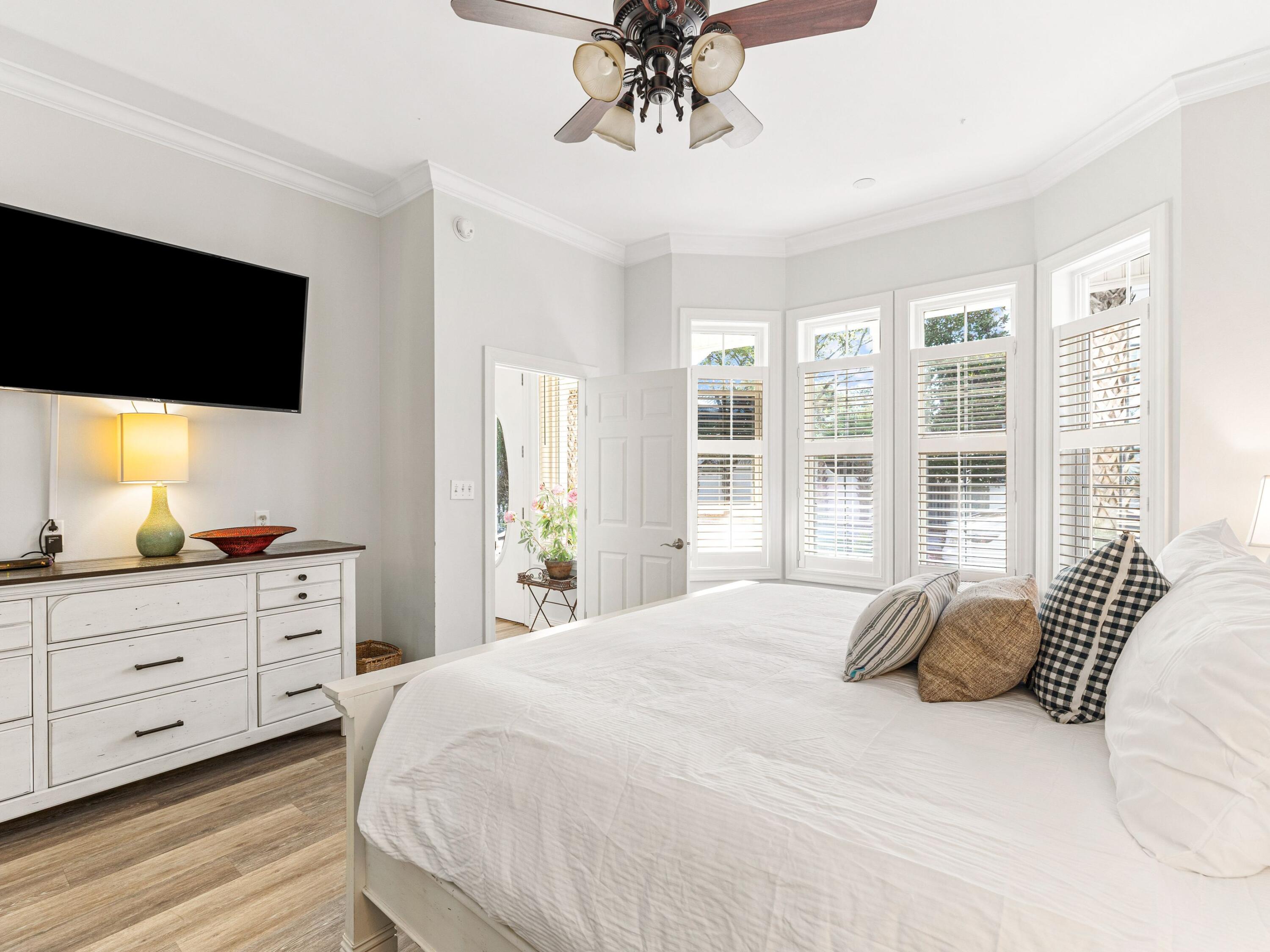 41 Winston Lane Inlet Beach, FL 32461 - Photo 31 of 50 a bedroom with a large bed and a flat tv screen on dresser
