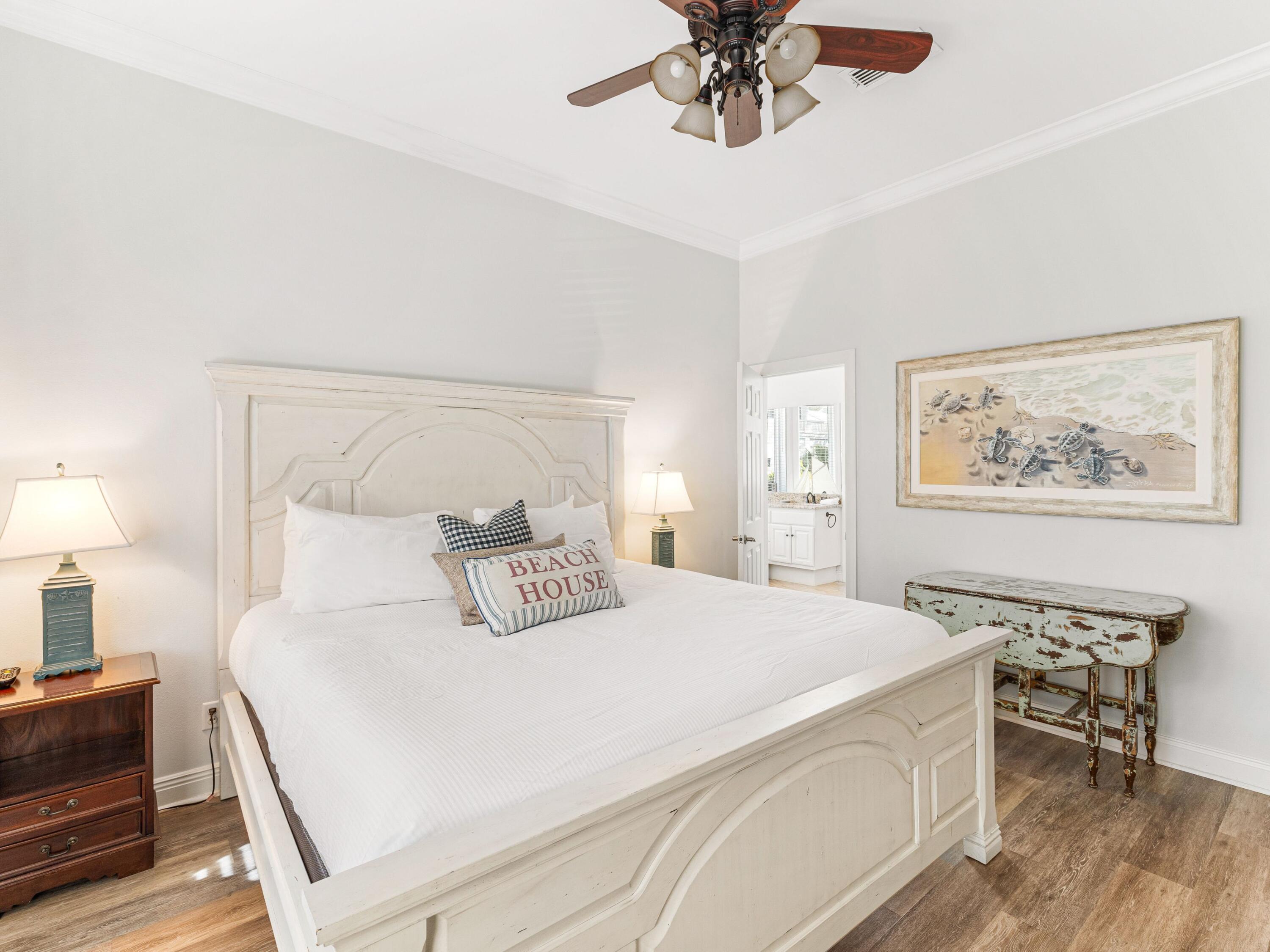 41 Winston Lane Inlet Beach, FL 32461 - Photo 32 of 50 a bedroom with a large bed and a chandelier