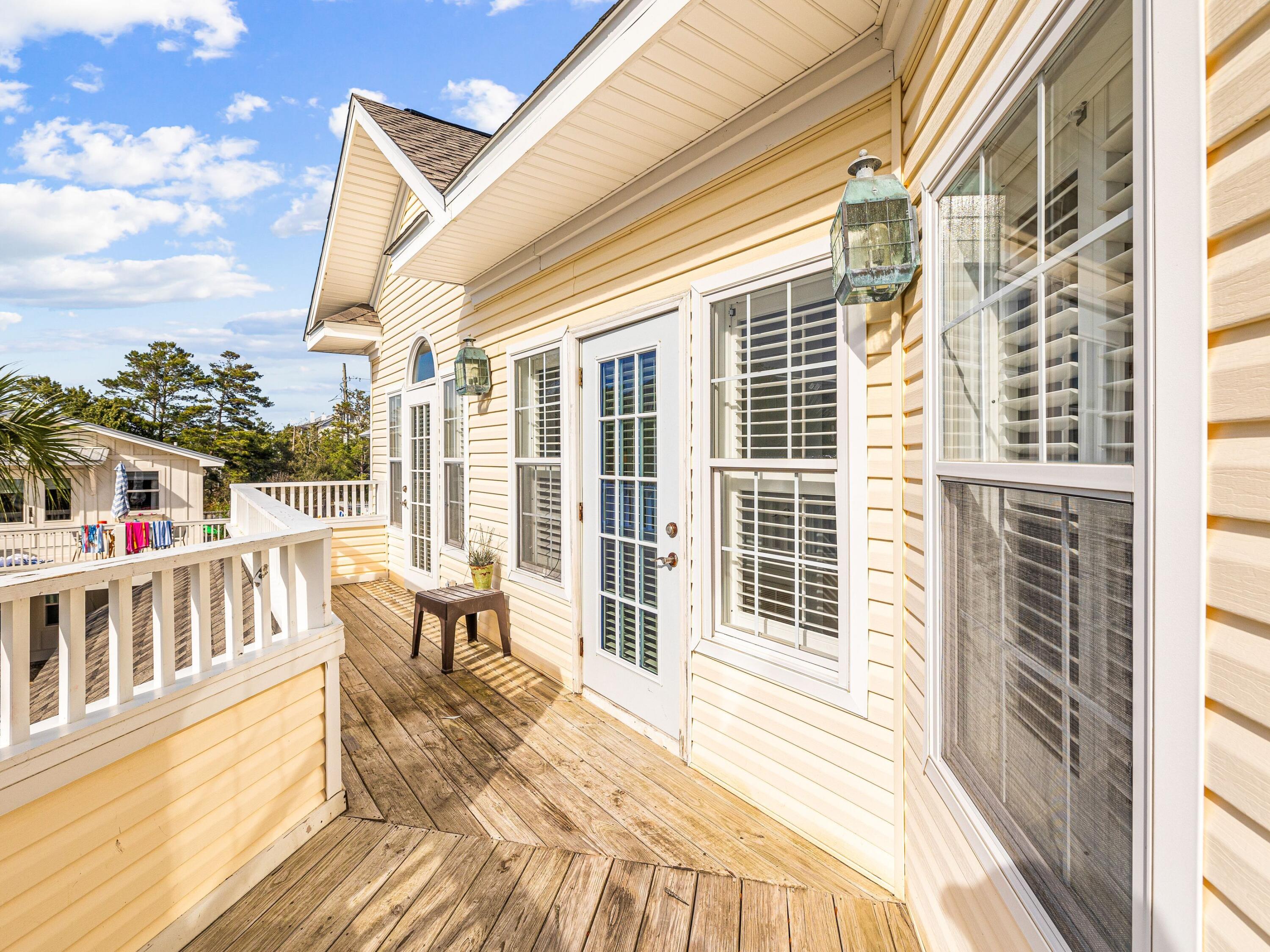 41 Winston Lane Inlet Beach, FL 32461 - Photo 41 of 50 a balcony with wooden floor and furniture