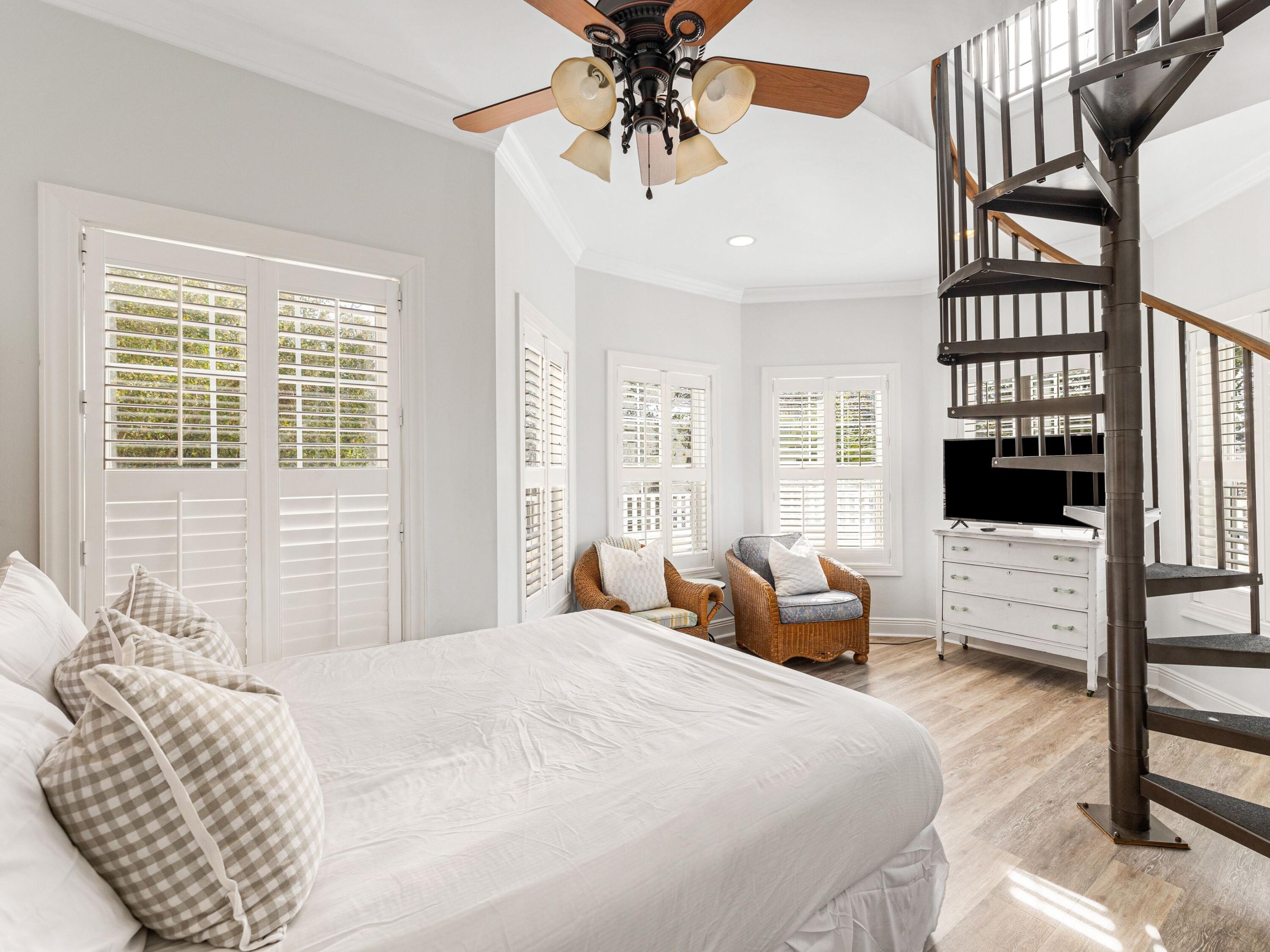 41 Winston Lane Inlet Beach, FL 32461 - Photo 45 of 50 a bedroom with a balcony a bed and a chandelier