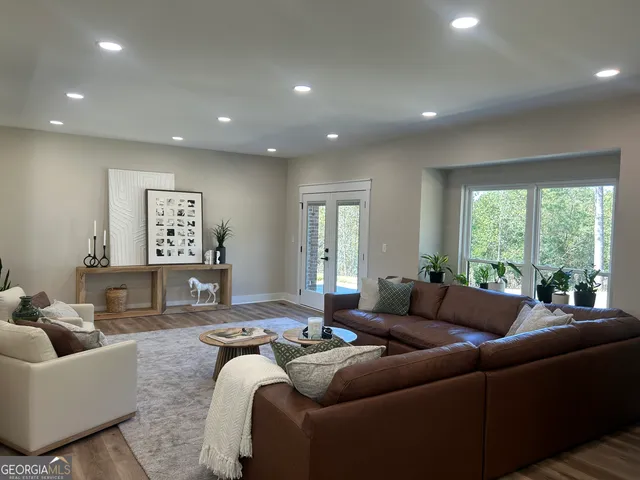 a kitchen with stainless steel appliances granite countertop a sink stove cabinets and refrigerator