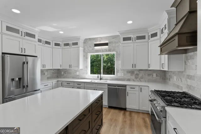 a kitchen with a table chairs stove and refrigerator
