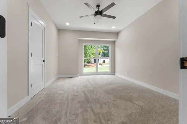 a view of empty room with wooden ceiling