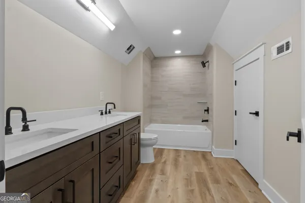 a view of a playground with a house