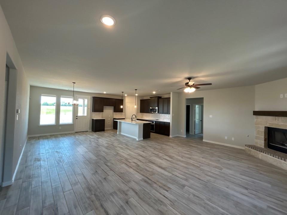 8779 County Road 623 Blue Ridge, TX 75424 - Photo 4 of 14 Spacious open-concept living area featuring wood-finish flooring