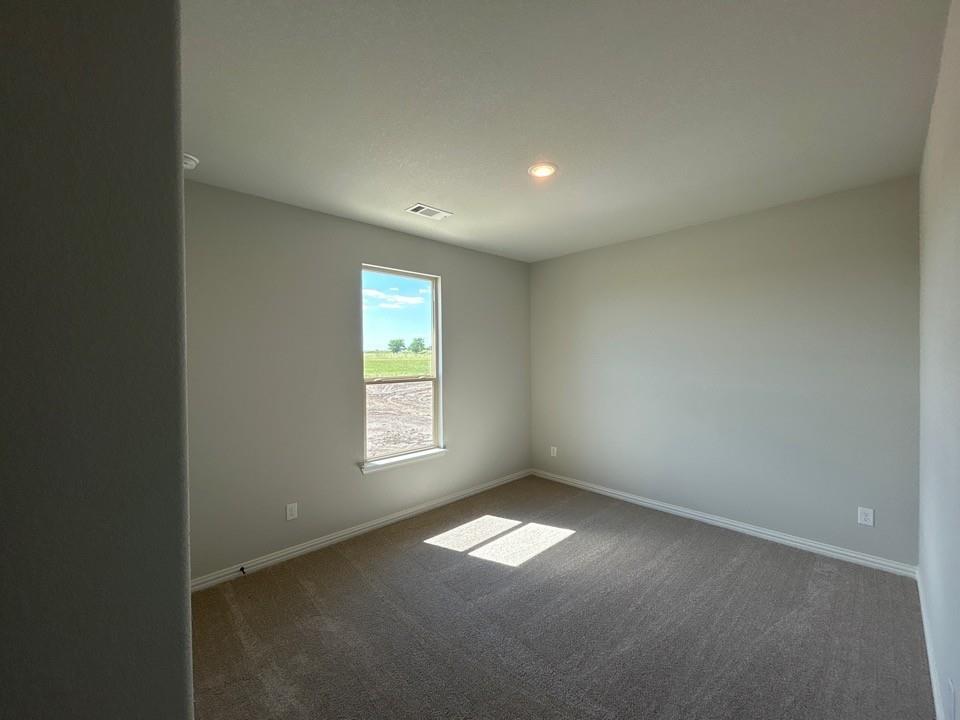 8779 County Road 623 Blue Ridge, TX 75424 - Photo 6 of 14 Kitchen featuring dark wood-finish cabinetry, light countertops, and a subway tile backsplash