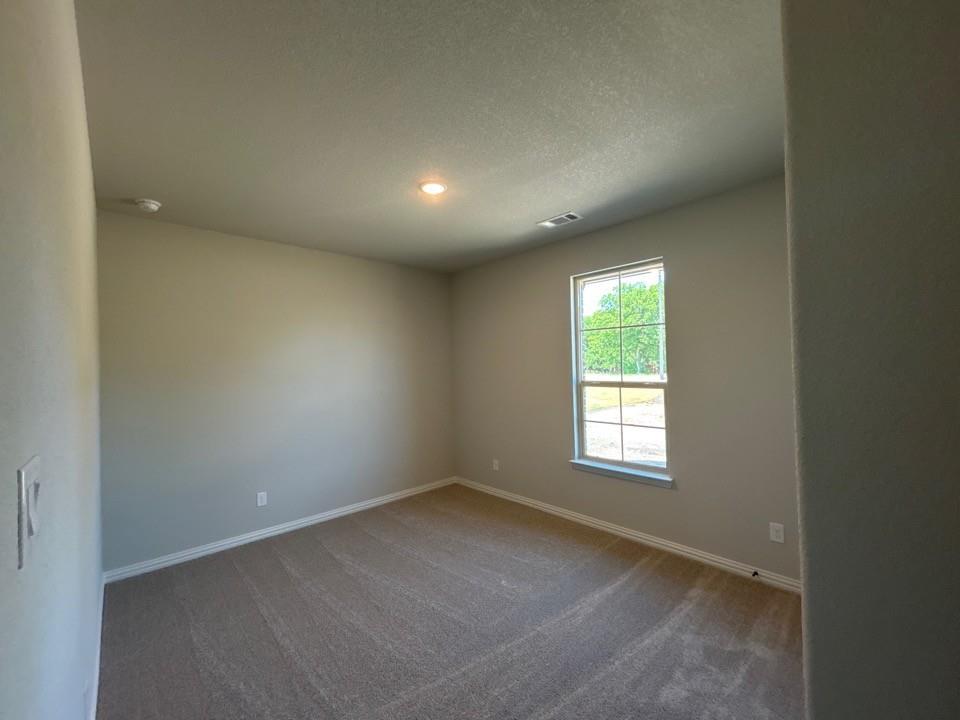 8779 County Road 623 Blue Ridge, TX 75424 - Photo 9 of 14 Room featuring neutral wall finishes and a single-pane window with exterior views