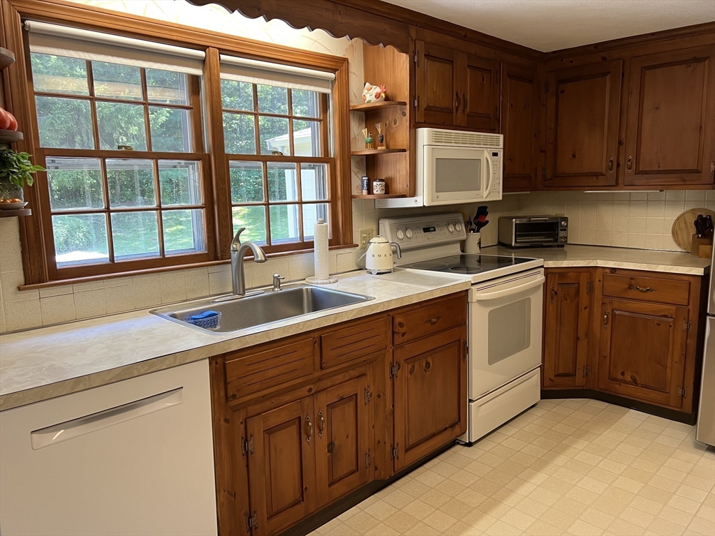 71 Greenbrook Road Hamilton, MA 01982 - Photo 14 of 33 a kitchen with a sink stove and microwave